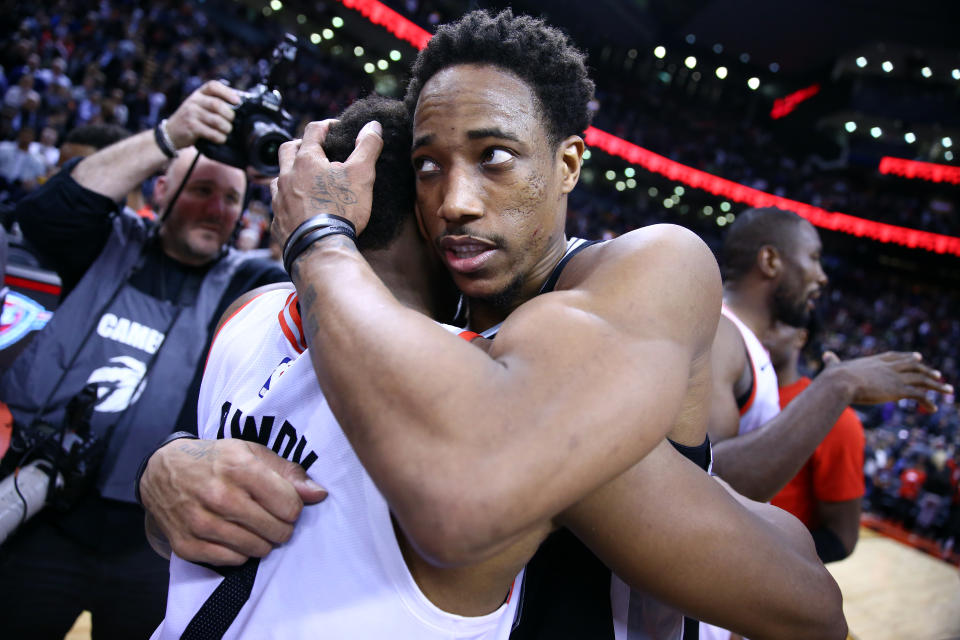 TORONTO, ON - FEBRUARY 22:  DeMar DeRozan #10 of the San Antonio Spurs hugs Kyle Lowry #7 of the Toronto Raptors following an NBA game at Scotiabank Arena on February 22, 2019 in Toronto, Canada.  NOTE TO USER: User expressly acknowledges and agrees that, by downloading and or using this photograph, User is consenting to the terms and conditions of the Getty Images License Agreement.  (Photo by Vaughn Ridley/Getty Images)