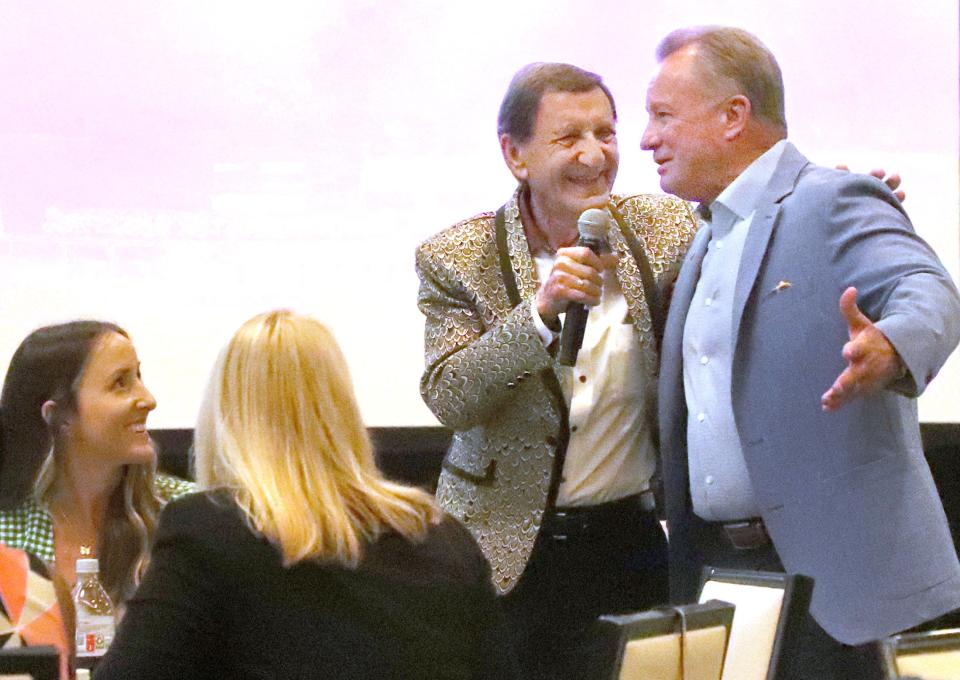 Bob Davis, president and CEO of the Lodging & Hospitality Association of Volusia County, shares a laugh with Bill Boggs, senior vice president of National Cheerleaders Association, at a National Tourism Week event on Wednesday at Hard Rock Hotel in Daytona Beach.  At the event, it was announced that Volusia County attracted 9.9. million visitors in 2021, slightly ahead of the total for pre-COVID 2019.