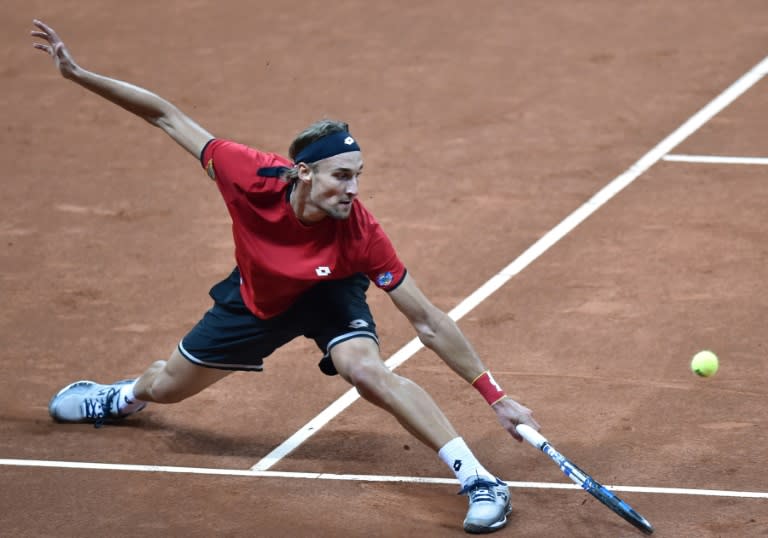 Belgium's Ruben Bemelmans returns the ball to Britain's Andy Murray during their tennis match on the first day of the Davis Cup final between Belgium and Britain at the Flanders Expo in Ghent on November 27, 2015