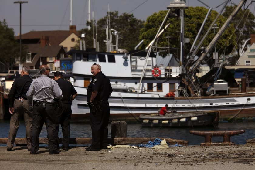 LAPD Harbor Division detectives and police officers investigate the scene of a crash in 2015 in San Pedro.