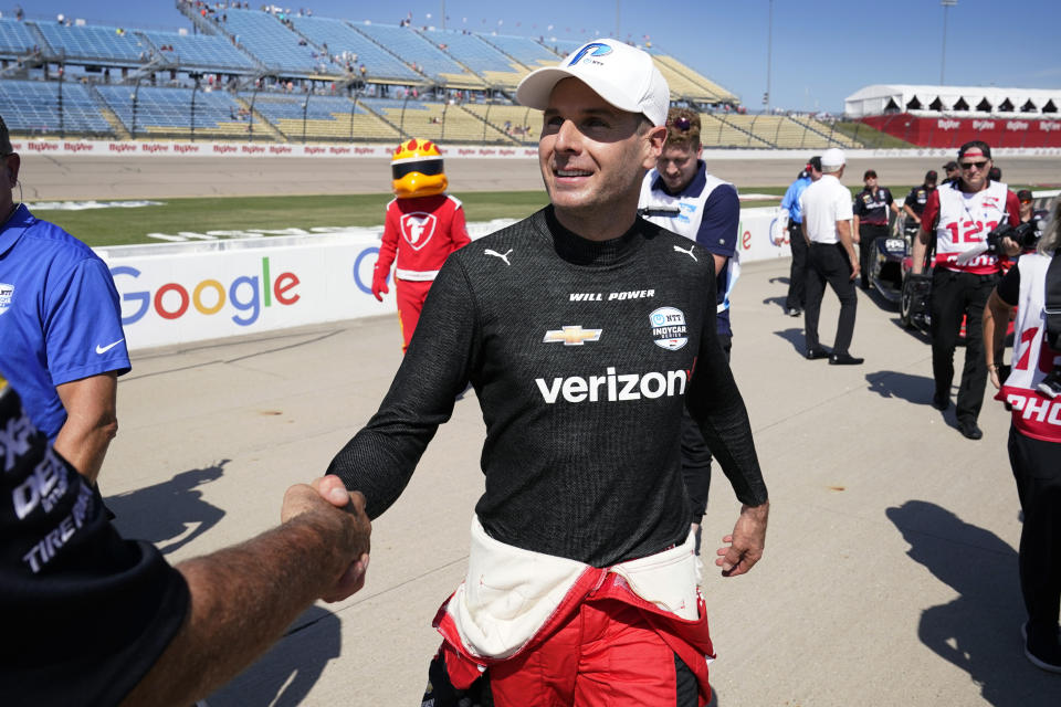 Will Power, of Australia, reacts on pit road after winning the pole position for an IndyCar Series auto race, Saturday, July 23, 2022, at Iowa Speedway in Newton, Iowa. (AP Photo/Charlie Neibergall)