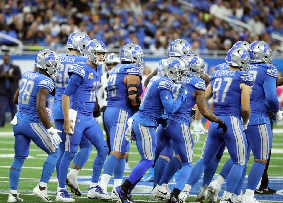 Detroit Lions quarterback Jared Goff (16) and the offense line up against the Carolina Panthers during second-half action at Ford Field in Detroit on Sunday, Oct, 8, 2023.