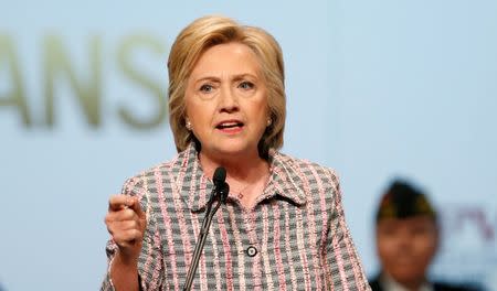 U.S. Democratic presidential candidate Hillary Clinton gestures as she speaks at the Veterans of Foreign Wars Convention in Charlotte, North Carolina, U.S. July 25, 2016. REUTERS/Chris Keane