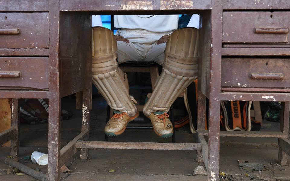 Boy in pads waits his turn