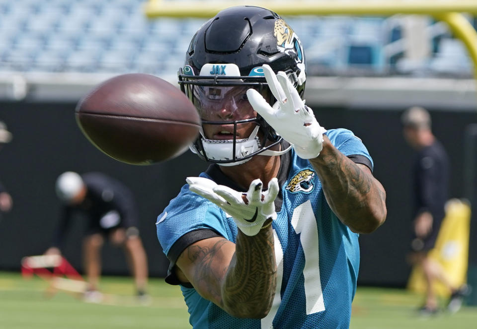 Jacksonville Jaguars wide receiver Marvin Jones (11) goes through a passing drill during an NFL football practice, Monday, May 23, 2022, in Jacksonville, Fla. (AP Photo/John Raoux)