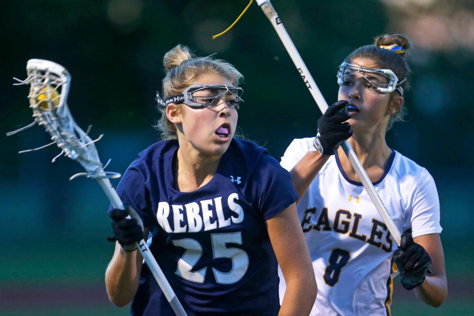 South Kingstown's Ella Martin, left, tries to get past Barrington's Stella Hillier during Wednesday's playoff game.