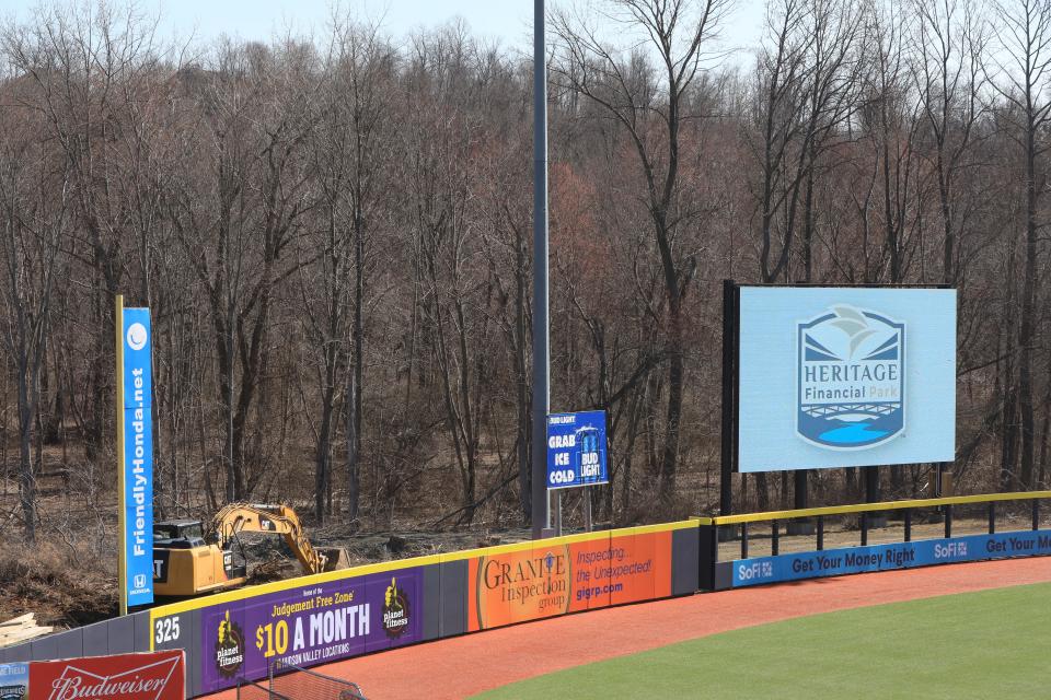 Construction equipment behind the left field wall and a video screen displaying the new name of Dutchess Stadium which is now called Heritage Financial Park on March 21, 2023. 