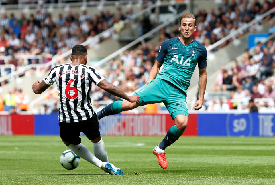 Harry Kane tries to win the ball from in action with Newcastle United’s Jamaal Lascelles