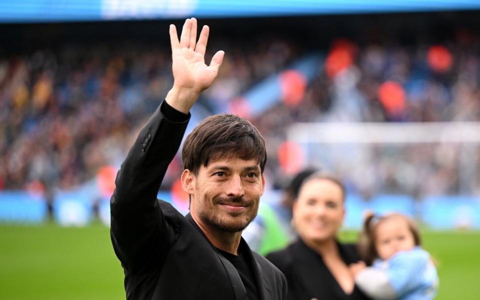 David Silva acknowledges the fans on the pitch prior to the Premier League match