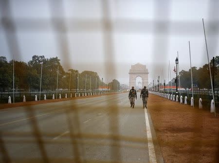 Indian security personnel patrol near India Gate ahead of the Republic Day parade in New Delhi January 24, 2015. REUTERS/Anindito Mukherjee