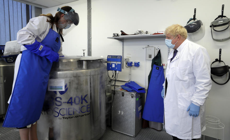 Prime Minister Boris Johnson is shown samples stored in liquid nitrogen by Professor Kate Ewer during a visit to the Jenner Institute in Oxford, where toured the laboratory and met scientists who are leading the COVID vaccine research.