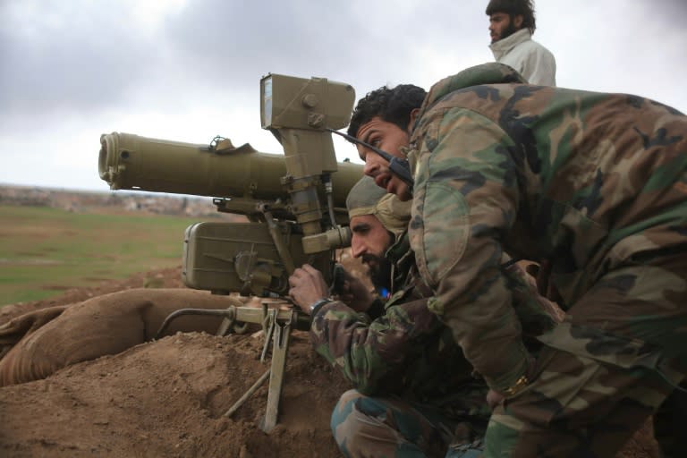 Syrian pro-government forces man a position in the Hatabat al-Bab area, east of Aleppo, on January 24, 2016