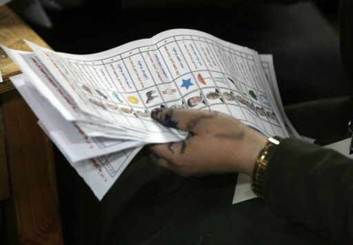 An Egyptian election official counts ballot papers at a polling station in Cairo, May 24. Vote counting was underway in Egypt Friday after two days of polling in a landmark presidential election which pitted stability against the ideals of the uprising that ended Hosni Mubarak's rule