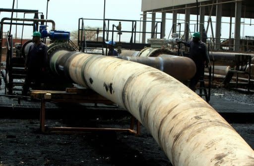 A Sudanese repair crew works at the Heglig oil facility, after Sudan started pumping oil from the war-damaged facility in May 2012. Sudan and South Sudan have hammered out a deal over oil, resolving a key part of a bitter dispute that brought the rivals to the brink of all-out war earlier this year