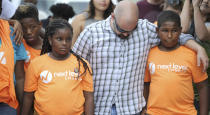 <p>Members of the community gather for a prayer vigil outside of the Club Blu after a shooting attack at a nightclub in Fort Myers, Fla., on July 25, 2016. (REUTERS/Chris Tilley)</p>