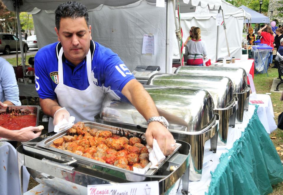 Brian Torello prepares meatballs for patrons of Festa Italiana's 'Festival in the Park' in 2016.