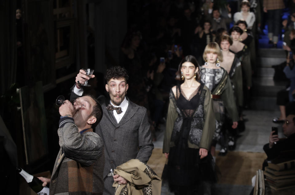 Models wear creations as actors perform, part of the Antonio Marras women's Fall-Winter 2019-2020 collection, that was presented in Milan, Italy, Sunday, Feb.24, 2019. (AP Photo/Luca Bruno)