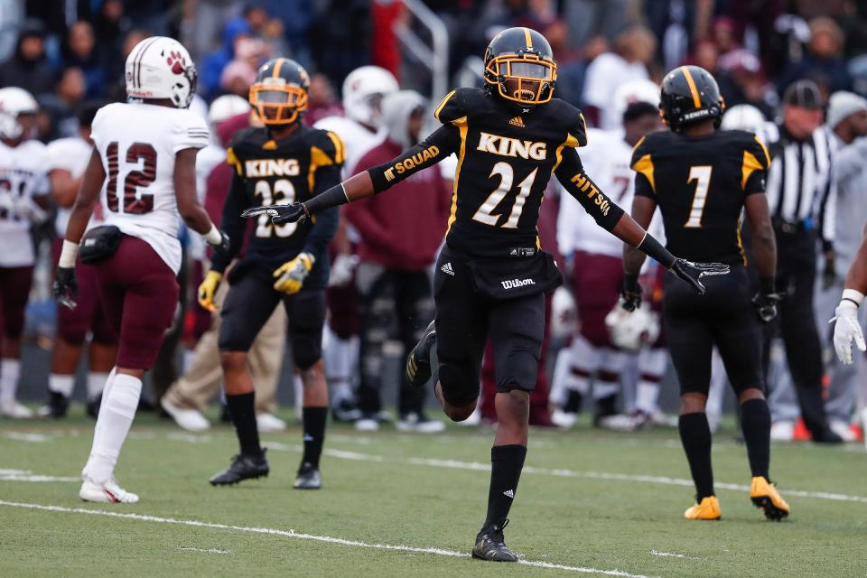 Detroit King defensive back Ahmad Gardner (21) celebrates a tackle against River Rouge during a game in October 2018.