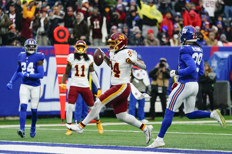 Washington Football Team running back Antonio Gibson (24) crosses the goal line for a touchdown against the New York Giants during the fourth quarter of an NFL football game, Sunday, Jan. 9, 2022, in East Rutherford, N.J. (AP Photo/Frank Franklin II)