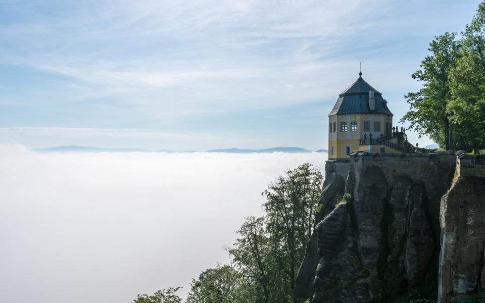 View from the Fortress Königstein on a misty day in the Saxon Switzerland - David Ziegler /iStockphoto 