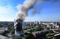 <p>A view on the burning Grenfell Tower, a 24-storey apartment block in North Kensington, London, Britain, June 14, 2017. (Andy Rain/EPA) </p>