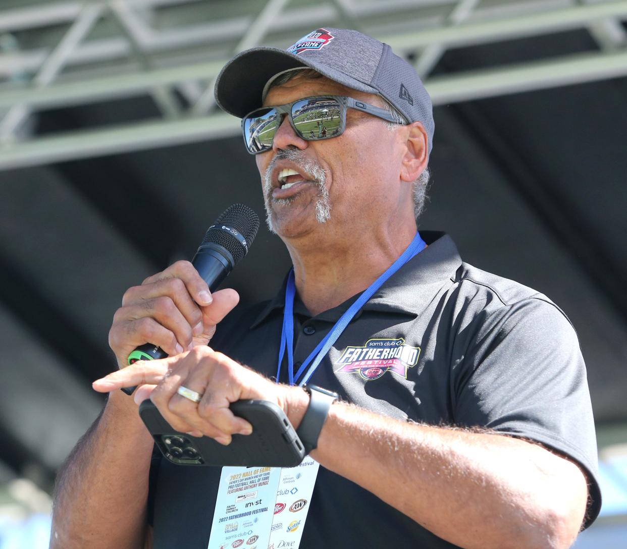 Former NFL great Anthony Munoz speaks Saturday during the three-day Hall of Fame Village Fatherhood Festival at Tom Benson Hall of Fame Stadium.