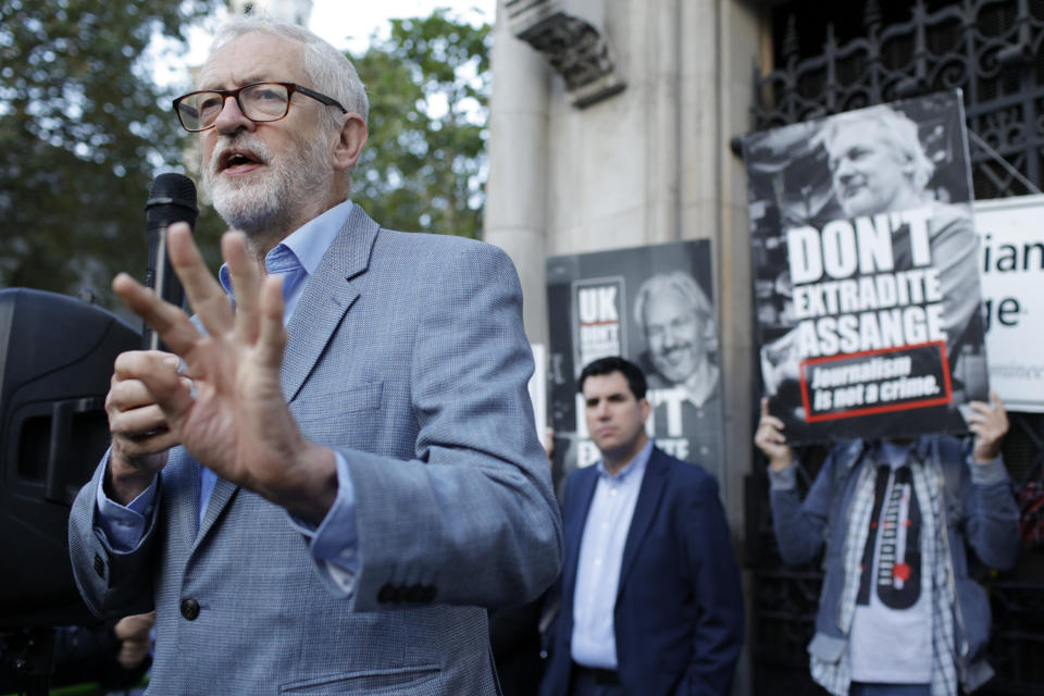 Former British Labour Party leader Jeremy Corbyn addresses Julian Assange supporters outside the High Court in London, Thursday, Oct. 28, 2021. The U.S. government is this week asking Britain's High Court to overturn a judge's decision that WikiLeaks founder Julian Assange should not be sent to the United States to face espionage charges. A lower court judge refused extradition in January on health grounds, saying Assange was likely to kill himself if held under harsh U.S. prison conditions. (AP Photo/David Cliff)