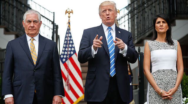 Donald Trump speaking to reporters on Friday pictured with Secretary of State Rex Tillerson, left, and US Ambassador to the United Nations Nikki Haley. Photo: AP