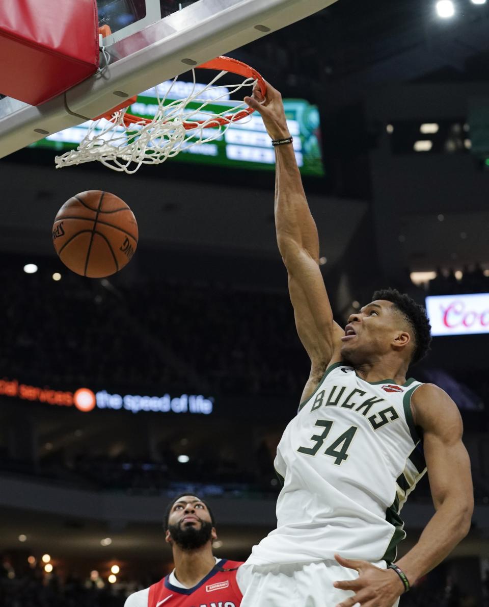 Milwaukee Bucks' Giannis Antetokounmpo dunks during the second half of an NBA basketball game against the New Orleans Pelicans Wednesday, Dec. 19, 2018, in Milwaukee. The Bucks won 123-115. (AP Photo/Morry Gash)