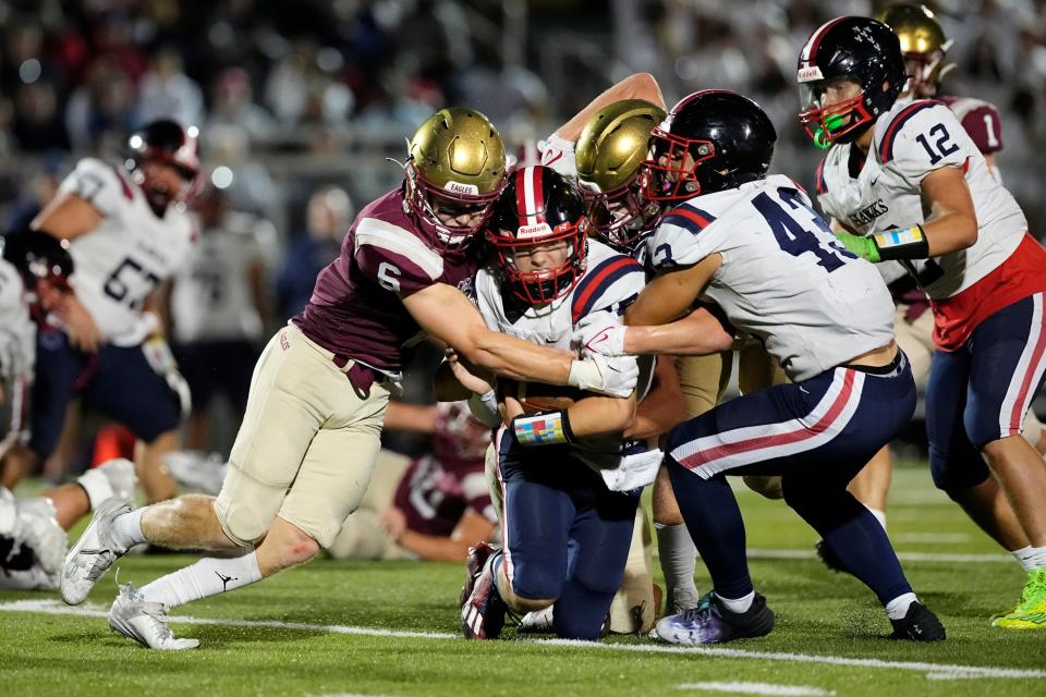 Dominic Purcell tackles Hartley’s Matt Galich during Watterson’s 35-7 win Sept. 22.