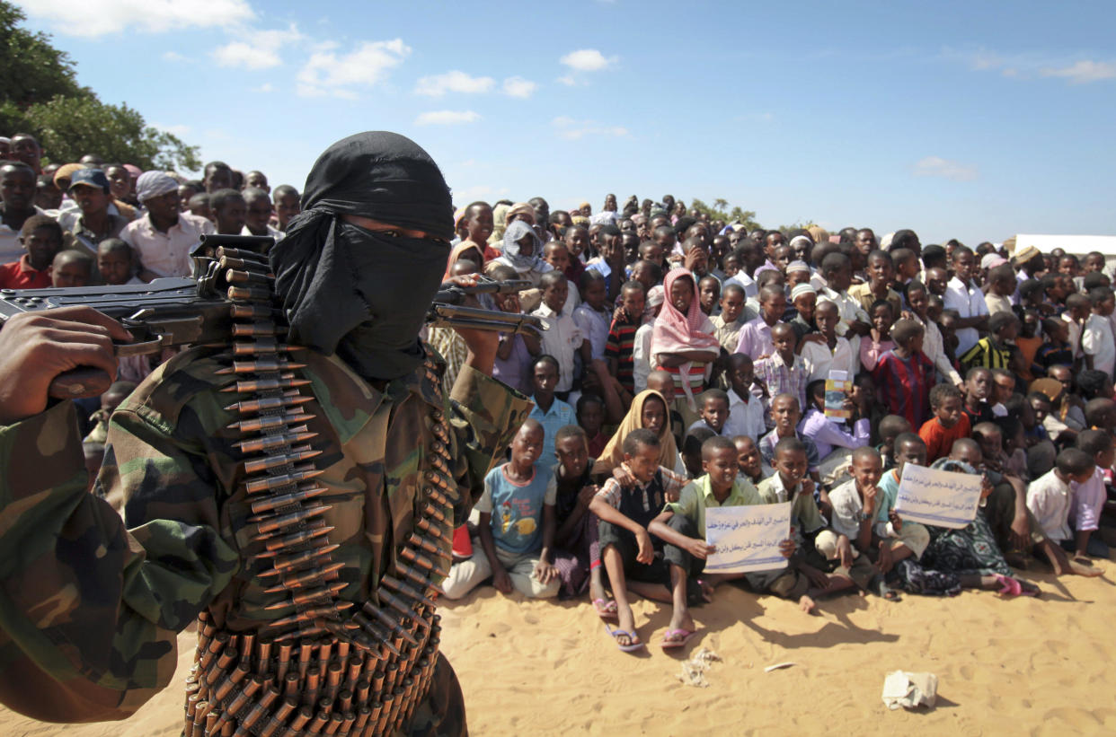 A February 13, 2012, file photo shows an armed member of the militant group al-Shabaab at a rally on the outskirts of Mogadishu, Somalia. / Credit: AP