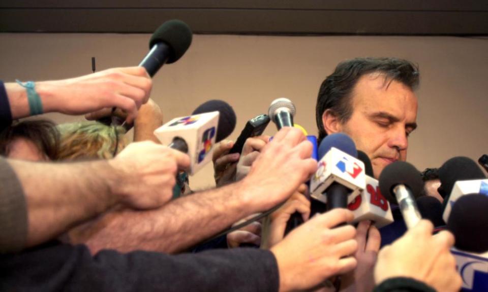 Marcelo Bielsa is surrounded by the media at Ezeiza airport in Buenos Aires after his Argentina side had been knocked out of the 2002 World Cup in the group stages