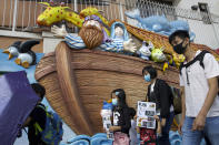 Parents and children wearing face masks participate in a rally to protest against the exposure of children to tear gas by police in Hong Kong, Saturday, Nov. 23, 2019. President Donald Trump on Friday wouldn't commit to signing bipartisan legislation supporting pro-democracy activists in Hong Kong as he tries to work out a trade deal with China. (AP Photo/Ng Han Guan)