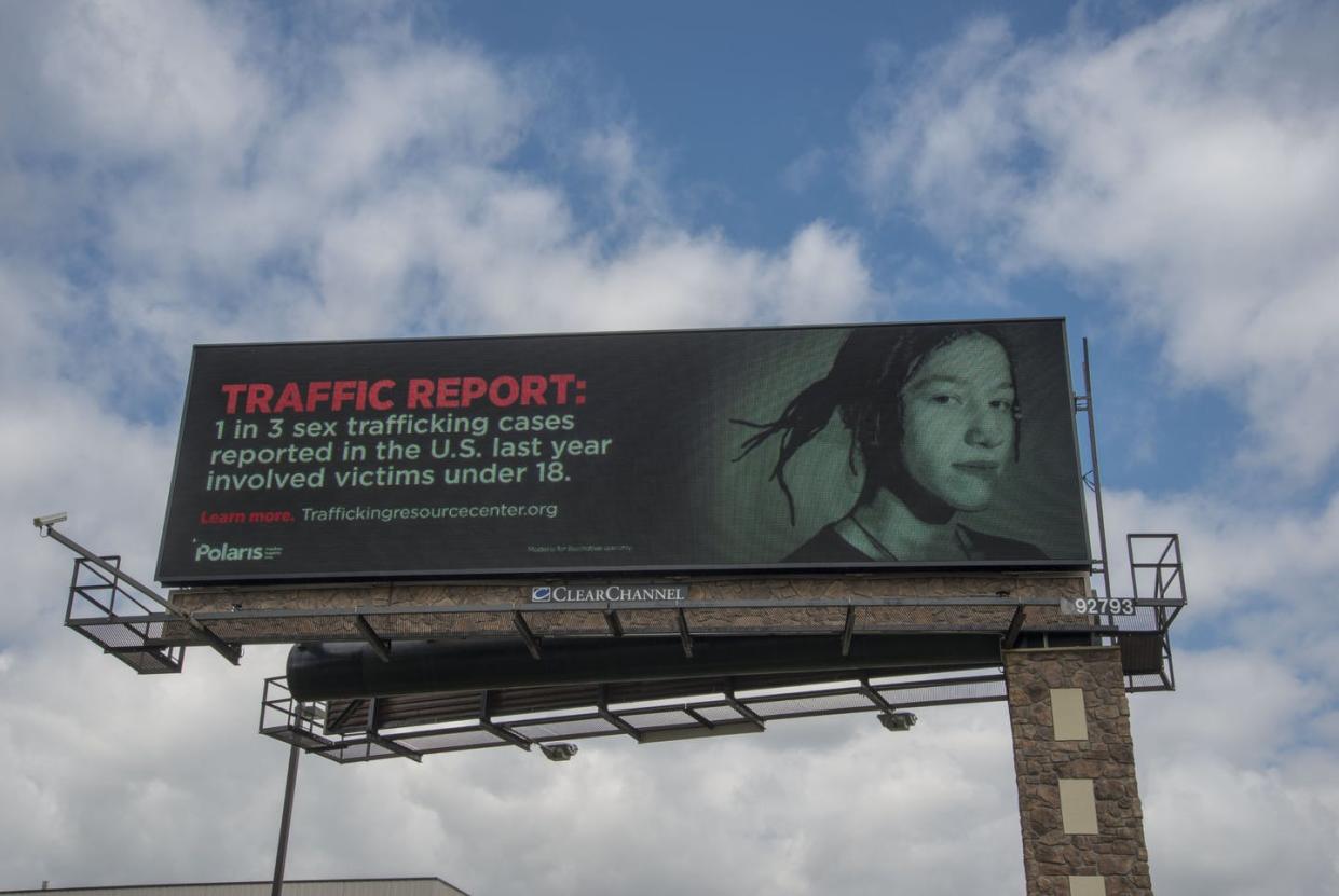 <span class="caption">A billboard in Mounds View, Minnesota, put up by the nonprofit National Human Trafficking Resource Center. </span> <span class="attribution"><a class="link " href="https://www.gettyimages.com" rel="nofollow noopener" target="_blank" data-ylk="slk:Education Images/Universal Images Group via Getty Images;elm:context_link;itc:0;sec:content-canvas">Education Images/Universal Images Group via Getty Images</a></span>