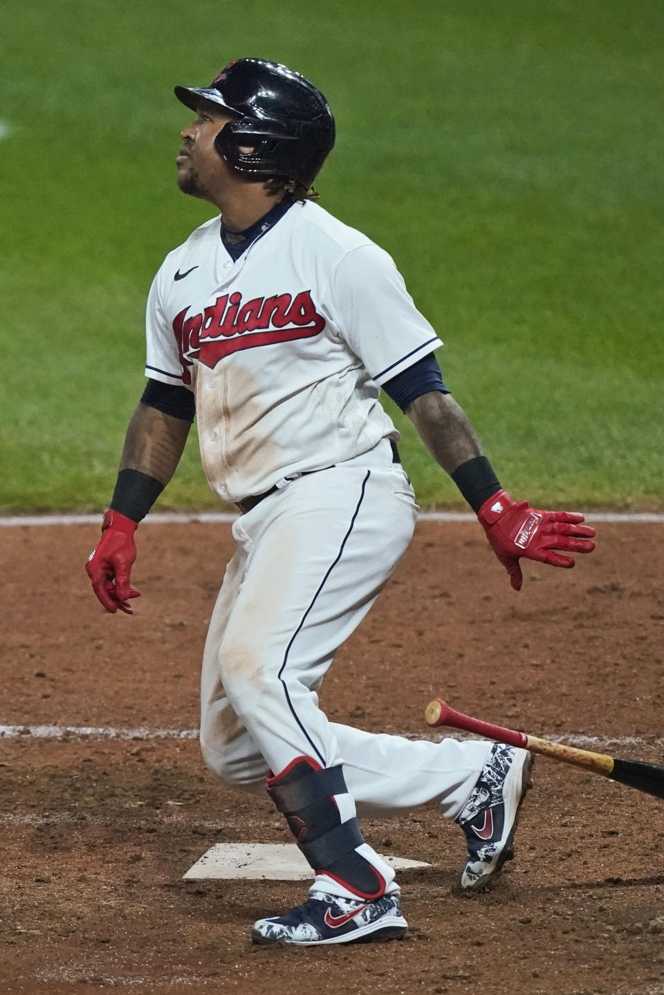 Cleveland Indians' Jose Ramirez watches his two-run double during the seventh inning of the team's baseball game against the Chicago White Sox, Thursday, Sept. 24, 2020, in Cleveland. (AP Photo/Tony Dejak)