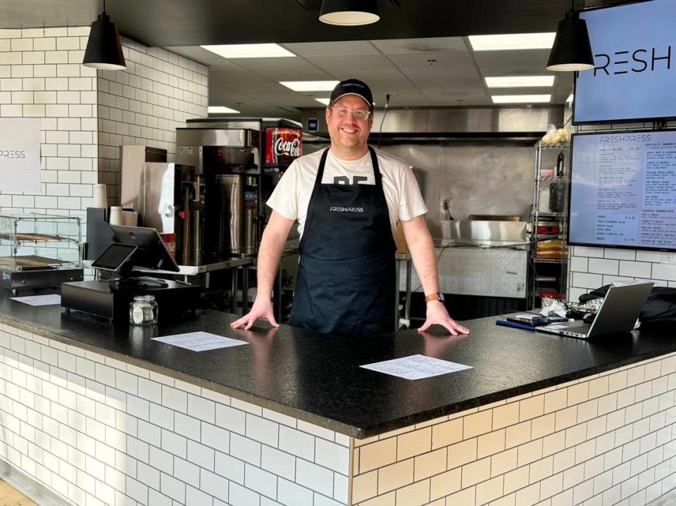 Kevan Cohn, owner of FRESHPRESS sandwich shop, stands in his booth Wednesday at the Power House in Rock Hill. Tracy Kimball/tkimball@heraldonline.com