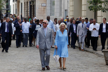 Britain's Prince Charles and Camilla, Duchess of Cornwall, walk in Old Havana, Cuba, March 25, 2019. REUTERS/Stringer