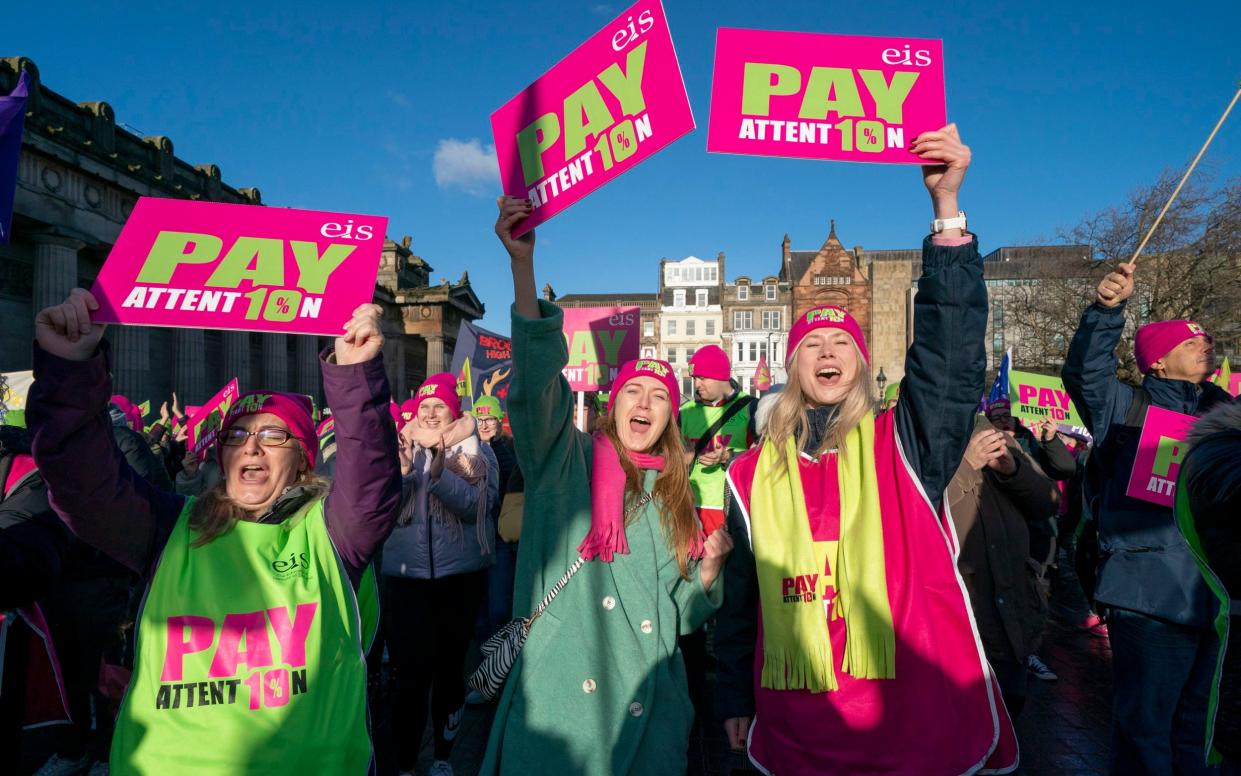 Teachers in Edinburgh campaigning over pay. Their counterparts in England are set to walk out of classrooms next week in a dispute about earnings - Jane Barlow/PA