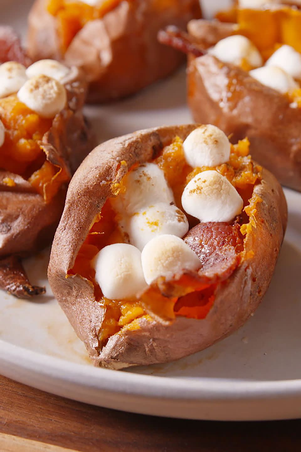 <p>Get your sweet and salty fix with these sweet potatoes loaded with marshmallows and bacon.</p><p><strong>Get the recipe at <a href="http://www.delish.com/cooking/recipe-ideas/recipes/a44616/twice-baked-sweet-potatoes-bacon-brown-sugar-marshmallows-recipe/" rel="nofollow noopener" target="_blank" data-ylk="slk:Delish" class="link rapid-noclick-resp">Delish</a>. </strong><br></p>