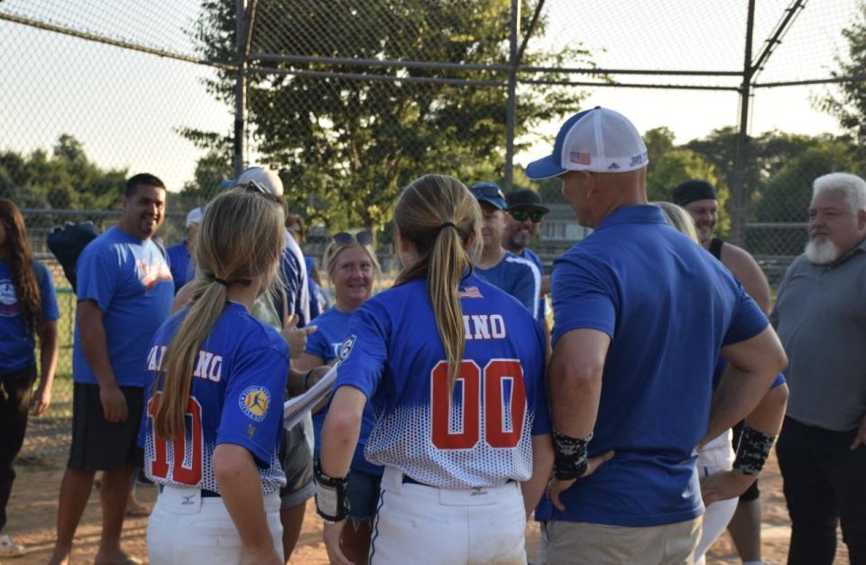 Toms River players Kylie Paladino (left) and Izzy Cino and team manager Jim Cino