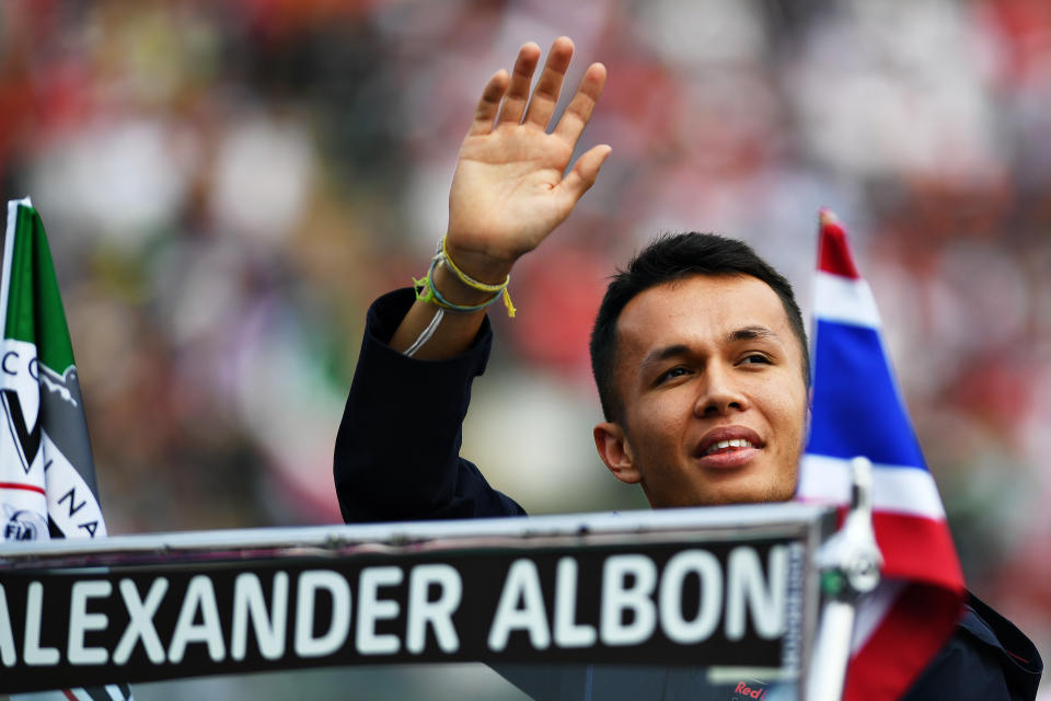 MEXICO CITY, MEXICO - OCTOBER 27: Alexander Albon of Thailand and Red Bull Racing waves to the crowd on the drivers parade before the F1 Grand Prix of Mexico at Autodromo Hermanos Rodriguez on October 27, 2019 in Mexico City, Mexico. (Photo by Clive Mason/Getty Images)