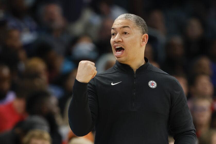 Los Angeles Clippers coach Tyronn Lue defends a call during the second half of an NBA basketball game.
