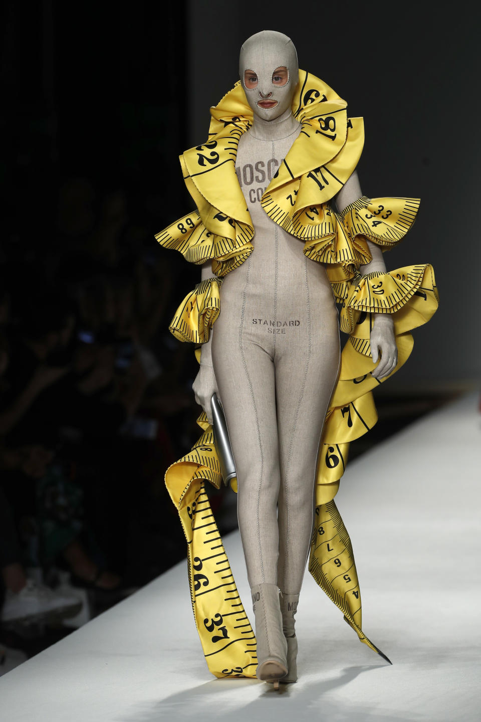 A model wears a creation as part of the Moschino women's 2019 Spring-Summer collection, unveiled during the Fashion Week in Milan, Italy, Thursday, Sept. 20, 2018. (AP Photo/Antonio Calanni)