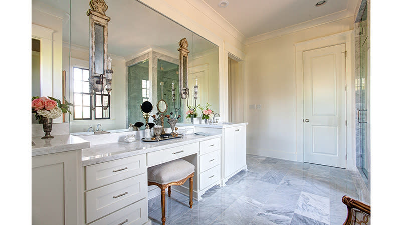 <p>An elegant vanity equipped with drawer space and a lengthy countertop makes for a dreamy dressing room. </p>