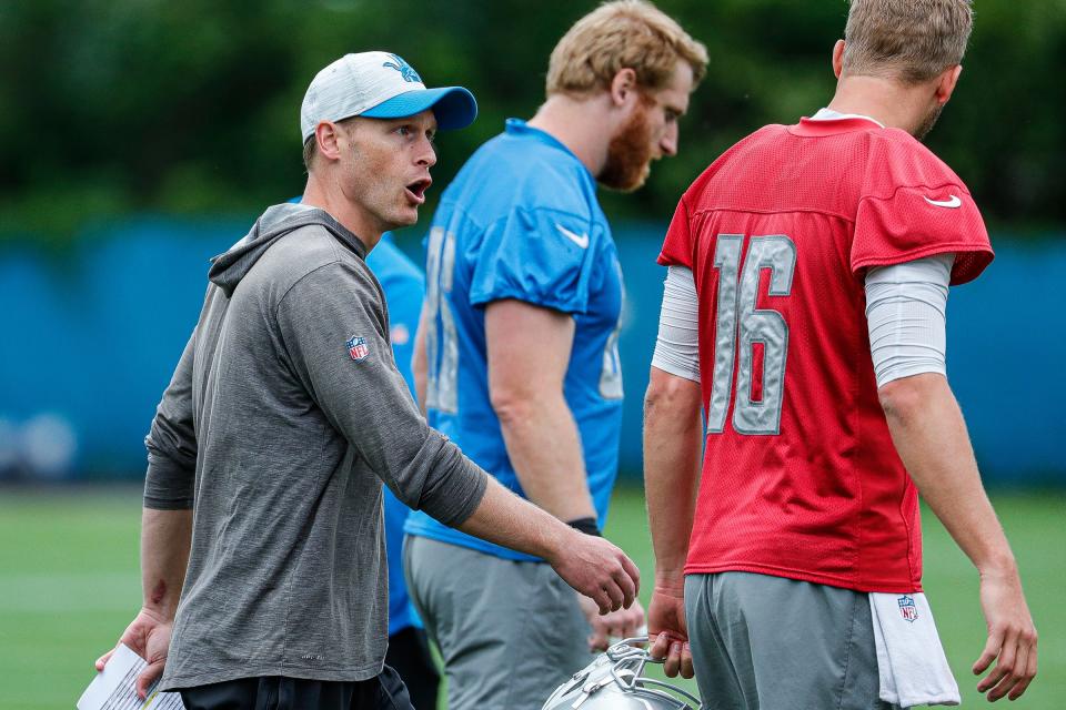 Detroit Lions offensive coordinator Ben Johnson talks to  quarterback Jared Goff (16) during mini camp at the practice facility in Allen Park on Tuesday, June 7, 2022.