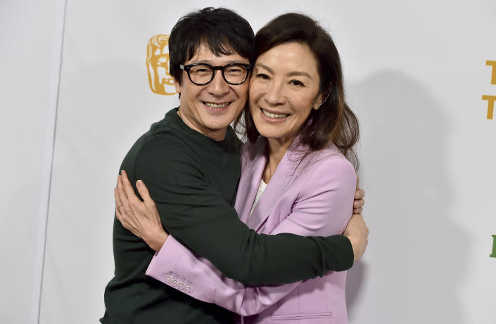 Ke Huy Quan, left, and Michelle Yeoh arrive at the 2023 BAFTA Tea Party, Saturday, Jan. 14, 2023, at the Four Seasons Hotel Los Angeles at Beverly Hills in Los Angeles. (Photo by Jordan Strauss/Invision/AP)