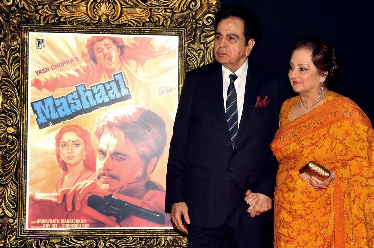 Indian Bollywood film actor Dilip Kumar (L) and his wife Saira Banu pose on the red carpet at a film premiere in 2012 (AFP via Getty Images)