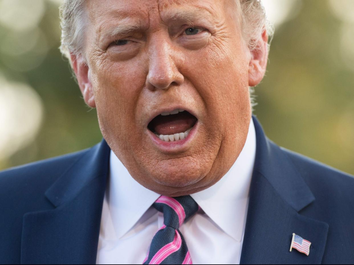 <p>Donald Trump speaks to the press as he departs the White House in Washington, DC, on 22 September, 2020</p> (AFP via Getty Images)