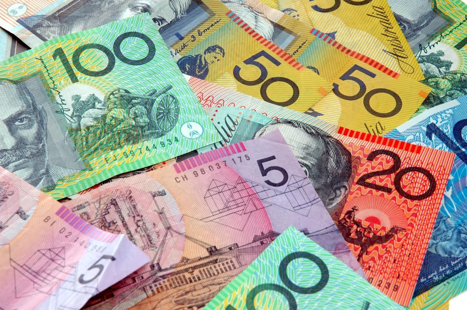 This picture shows a pile of Australian money as the Lucy Lotteries jackpot grows to $84 million.