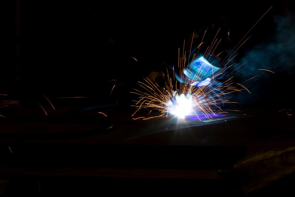 Magdalene Fett, 17, welds on Aug. 22, 2022, at Renco Machine Inc., in Green Bay, Wis. Fett is a part of the Wisconsin Apprenticeship Program.